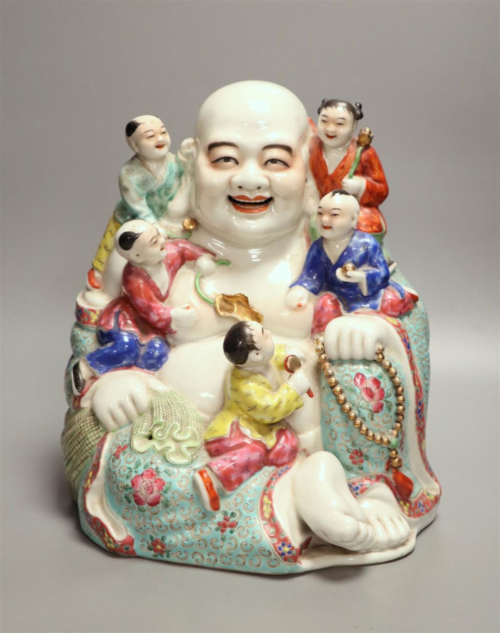 A large Chinese famille rose figure of Budai and children, mid 20th century, height 28cm